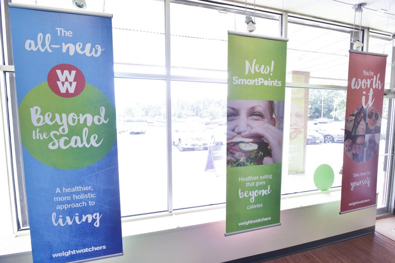 Weight Watchers logo displayed on a wall of windows
